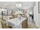 Open dining area with chandelier leading to a kitchen island and living space at 6467 Seasound Dr, Apollo Beach, FL 33572