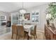 Cozy dining room with a chandelier, a table set for six, and bright natural light at 6467 Seasound Dr, Apollo Beach, FL 33572