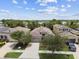 Charming single-Gathering home with a manicured lawn and a two-car garage, surrounded by lush greenery at 6467 Seasound Dr, Apollo Beach, FL 33572