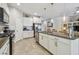 Open kitchen with granite counters, stainless appliances, and seamless flow to living areas at 6467 Seasound Dr, Apollo Beach, FL 33572