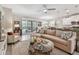 Cozy living room connected to dining and kitchen area, with bright natural light at 6467 Seasound Dr, Apollo Beach, FL 33572