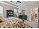A main bedroom with ceiling fan, large bed, shelving, and a view at 6467 Seasound Dr, Apollo Beach, FL 33572