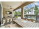 Enjoy outdoor dining on this screened patio overlooking the pool and backyard at 6467 Seasound Dr, Apollo Beach, FL 33572