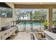 A screened patio provides a beautiful view of a swimming pool at 6467 Seasound Dr, Apollo Beach, FL 33572