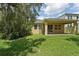 Backyard view showcasing a covered patio and fenced-in yard at 6706 Riverside Bluffs Dr, Riverview, FL 33578