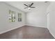 Bedroom with tile floor, ceiling fan, windows and a closet at 6706 Riverside Bluffs Dr, Riverview, FL 33578