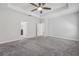 Spacious bedroom featuring plush carpeting with entrances to bathroom and closet at 6706 Riverside Bluffs Dr, Riverview, FL 33578
