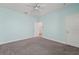 Comfortable bedroom featuring soft carpeting, light blue walls, and convenient access to other rooms at 6706 Riverside Bluffs Dr, Riverview, FL 33578