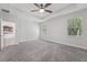 Spacious bedroom featuring plush carpeting and sunlit windows at 6706 Riverside Bluffs Dr, Riverview, FL 33578
