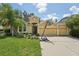 Charming single-Gathering home boasts a three-car garage, well-maintained lawn, and a basketball hoop on the driveway at 6706 Riverside Bluffs Dr, Riverview, FL 33578