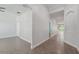 Open hallway with tile floors and views to the kitchen and living spaces at 6706 Riverside Bluffs Dr, Riverview, FL 33578