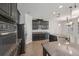 Modern kitchen features granite countertops, stainless steel appliances, and ample cabinet space at 6706 Riverside Bluffs Dr, Riverview, FL 33578