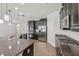 Modern kitchen features granite countertops, stainless steel appliances, and ample cabinet space at 6706 Riverside Bluffs Dr, Riverview, FL 33578