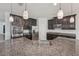 Modern kitchen features granite countertops, stainless steel appliances, and ample cabinet space at 6706 Riverside Bluffs Dr, Riverview, FL 33578