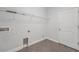 Compact laundry area with tile floors, ample shelving, and essential hookups for appliances at 6706 Riverside Bluffs Dr, Riverview, FL 33578