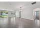 Spacious living room features tile flooring, sliding glass doors, and lots of natural light at 6706 Riverside Bluffs Dr, Riverview, FL 33578