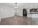 Open-concept living space with tile flooring, ample room for entertaining, and easy access to the kitchen at 6706 Riverside Bluffs Dr, Riverview, FL 33578