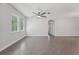 Neutral living room features tile flooring, abundant natural light, and an inviting atmosphere, making it a perfect place to relax at 6706 Riverside Bluffs Dr, Riverview, FL 33578