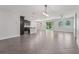 Expansive living area featuring tile floors, great natural light, and seamlessly connects to the adjacent kitchen at 6706 Riverside Bluffs Dr, Riverview, FL 33578