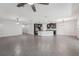 Spacious open-concept living room and kitchen features tile flooring and modern light fixtures at 6706 Riverside Bluffs Dr, Riverview, FL 33578