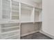 Walk-in closet with custom shelving and ample storage at 6706 Riverside Bluffs Dr, Riverview, FL 33578