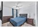 Comfortable bedroom with a tufted headboard bed, bedside tables, and ample space for relaxation at 7124 Summer Holly Pl, Riverview, FL 33578