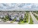 Neighborhood aerial view showcasing meticulously designed homes, lush landscaping and a well maintained community at 7517 Notched Pine Bnd, Wesley Chapel, FL 33545