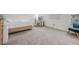 Well-lit bedroom with carpet and a desk, perfect for work and relaxation at 7517 Notched Pine Bnd, Wesley Chapel, FL 33545