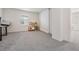 Bonus room featuring neutral walls, carpet, and window, providing a versatile space for Gathering at 7517 Notched Pine Bnd, Wesley Chapel, FL 33545