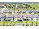 Aerial view of the house with a fenced backyard and manicured landscaping at 7700 Bronze Oak Dr, Wesley Chapel, FL 33545
