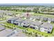 Aerial view of a neighborhood with fenced yards and sidewalks on a sunny day at 7700 Bronze Oak Dr, Wesley Chapel, FL 33545