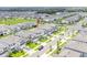 Aerial view of homes in a suburban neighborhood with a community park at 7700 Bronze Oak Dr, Wesley Chapel, FL 33545