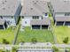 Aerial view of backyard featuring a screen porch, fenced yard, and landscaping at 7700 Bronze Oak Dr, Wesley Chapel, FL 33545