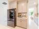 Contemporary kitchen features stainless steel appliances, ample cabinet space, and breakfast area at 7700 Bronze Oak Dr, Wesley Chapel, FL 33545
