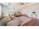 Upstairs living room featuring stylish sofas, a patterned rug, and modern decor at 7700 Bronze Oak Dr, Wesley Chapel, FL 33545