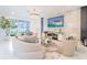 Bright living room features modern finishes, marble wall, and stylish furniture at 7700 Bronze Oak Dr, Wesley Chapel, FL 33545