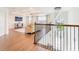 Cozy loft area with plush seating, tray ceiling, and an elegant chandelier at 7700 Bronze Oak Dr, Wesley Chapel, FL 33545