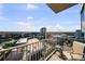 Breathtaking balcony view overlooking the city skyline from a modern condo with comfortable seating arrangement at 777 N Ashley Dr # 1903, Tampa, FL 33602