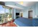 This bedroom has a large window with views and balcony access at 777 N Ashley Dr # 1903, Tampa, FL 33602