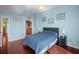 This bedroom has wood floors, artwork, and ensuite bath access at 777 N Ashley Dr # 1903, Tampa, FL 33602