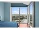 The bedroom has a large window with city views at 777 N Ashley Dr # 1903, Tampa, FL 33602