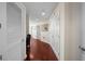 Bright hallway featuring wood floors, neutral walls, and multiple doors leading to rooms at 777 N Ashley Dr # 1903, Tampa, FL 33602
