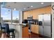 Modern kitchen with granite countertops, stainless steel appliances, and a breakfast bar, featuring great city views at 777 N Ashley Dr # 1903, Tampa, FL 33602