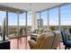 Bright living room with floor-to-ceiling windows and sliding glass doors to a balcony at 777 N Ashley Dr # 1903, Tampa, FL 33602