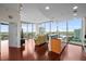 Open-concept living room featuring wood floors, floor-to-ceiling windows, and city views at 777 N Ashley Dr # 1903, Tampa, FL 33602