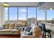 Cozy living room with floor-to-ceiling windows, city view, and comfortable seating at 777 N Ashley Dr # 1903, Tampa, FL 33602
