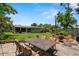 Outdoor patio area with stylish seating, lush landscaping, and a well-maintained lawn, perfect for entertaining at 791 66Th S Ave, St Petersburg, FL 33705
