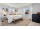 Cozy bedroom with neutral tones, a plush rug, natural lighting, and contemporary artwork at 791 66Th S Ave, St Petersburg, FL 33705