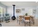 Charming dining area with a blue freestanding fireplace, creating a warm and inviting atmosphere for meals at 791 66Th S Ave, St Petersburg, FL 33705