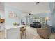 Bright living room with stylish furnishings, open to the kitchen with a breakfast bar for easy entertaining at 791 66Th S Ave, St Petersburg, FL 33705